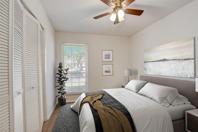 Bedroom featuring light wood-style flooring, a cl