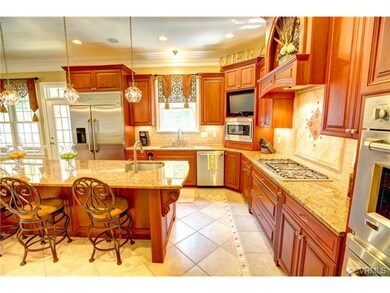 Gourmet kitchen with granite and stainless applian