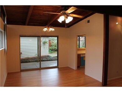 Dining room with more hardwoods and vaulted ceilin
