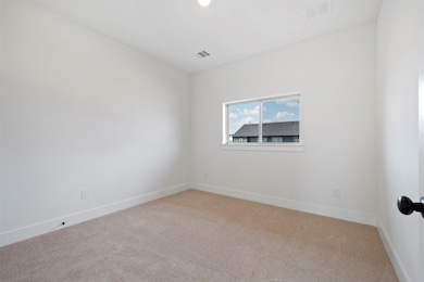 Spare room featuring carpet flooring and recessed lighting