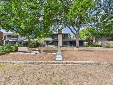 Mid-century inspired home with a patio and a chimney