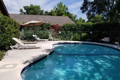 Community pool featuring a patio area