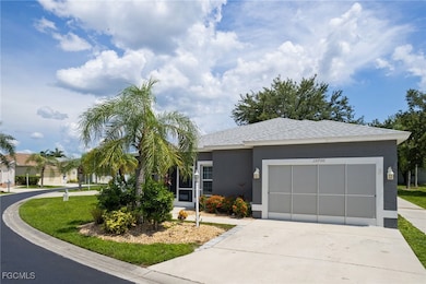 View of front facade featuring concrete driveway,