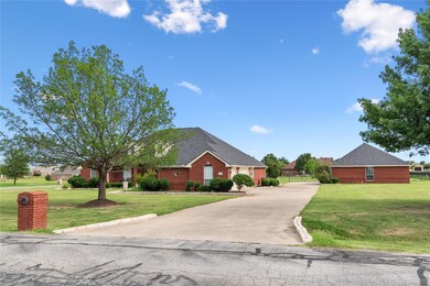 Home features side entry garage with a separate shop.