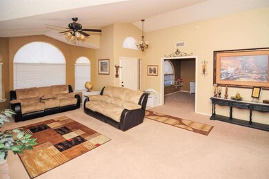 Family room w/ dbl door entrance to den