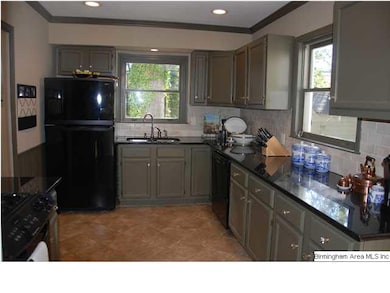 Kitchen with ample cabinet and coutertop space