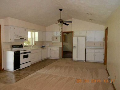Kitchen. Huge eat in kitchen with white cabinetry,