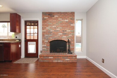 fireplace in dining area by kitchen
