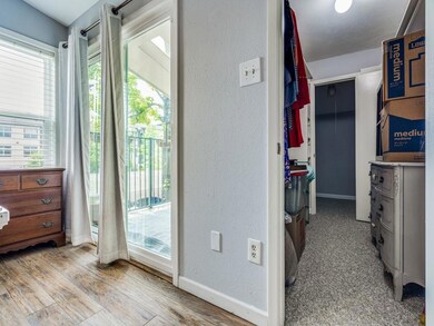 LARGE closet and balcony off primary bedroom.