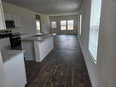 Kitchen with appliances with stainless steel fini