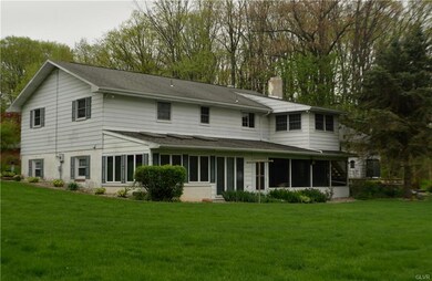 Back of home.  Lower level Sunroom is on the left.