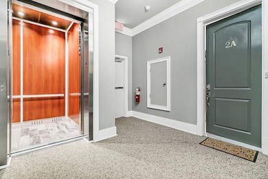 Elevator and Front Door to Condo Unit