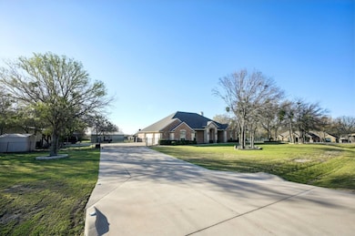 View of front of extended, gated driveway large en