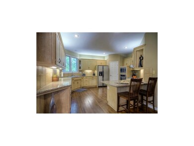 The kitchen features lots of cabinetry, pantry, gr