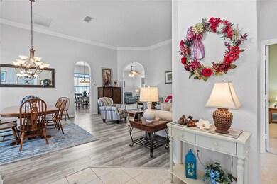Left of front entry is Dining room, living room, through arched doorway to Kitchen, to the right of entry is 2nd bedroom, den and bath