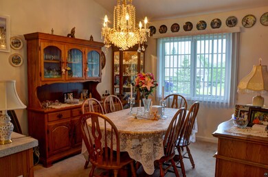 Dining space featuring a chandelier, lofted ceilin
