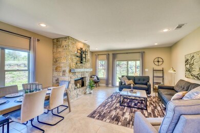 Living room featuring recessed lighting, a firepl