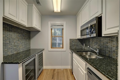 Kitchen featuring a sink, stainless steel applian