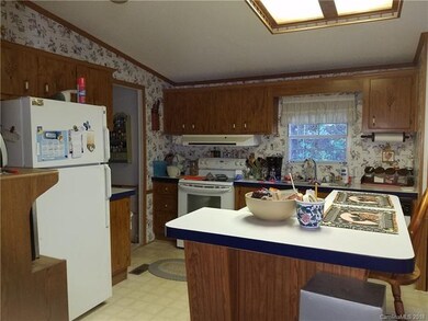Kitchen has plenty of storage and breakfast bar