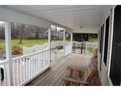 cozy back porch with access to fenced in yard