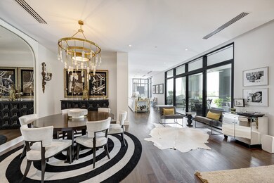 The elegant dining room opens to the kitchen and l
