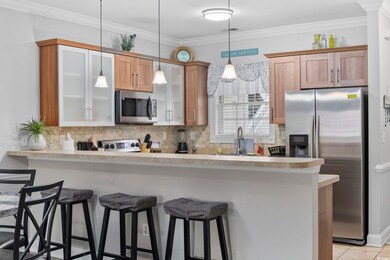 Kitchen featuring tasteful backsplash, sink, stain