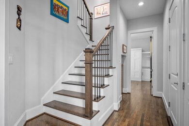 As you enter, you'll notice the wrought iron stairs leading to the 2nd floor and office to the left.