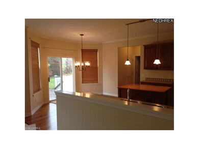 Pendent lighting and wood floors.
