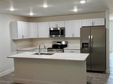 Kitchen featuring dark hardwood / wood-style floor