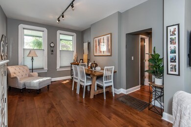 Adorable dining room with gleaming hardwood floors and fabulous windows!