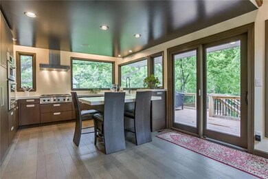 Cool kitchen with Gourmet appliances + Windows gal