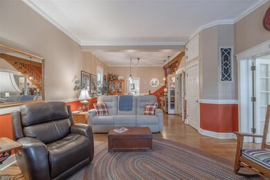 Enter the home into a large living room with open 
