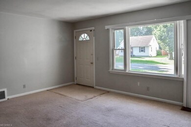 Spacious living room with a picture window.