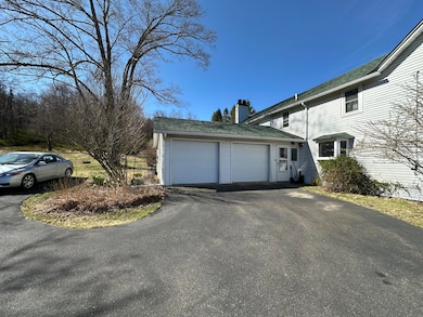 garage & paved driveway