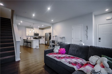 Living room featuring dark hardwood / wood-style f