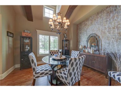 Lofty formal Dinning Room with exposed beams.