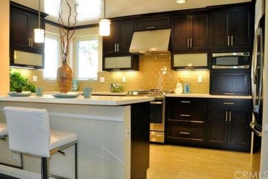 Contemporary renovated kitchen with custom cabinet