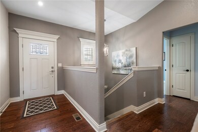Foyer on main level and staircase going down to lower level