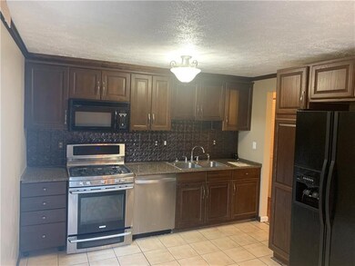 The kitchen boasts beautiful granite counter tops.