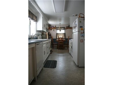 Kitchen. Efficiency here with crisp, clean white k
