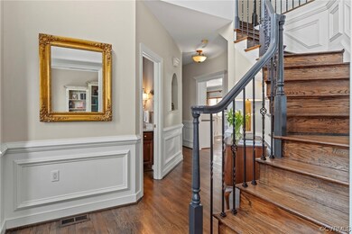 Stairs featuring dark hardwood / wood-style floors