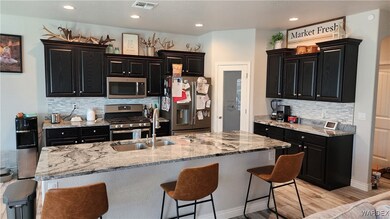 Kitchen with light hardwood / wood-style flooring,