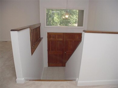 Entrance foyer has ceramic tile and wood steps