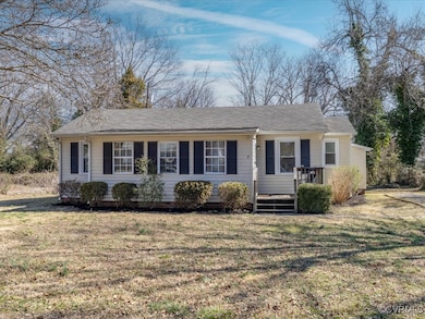 Single story home with a front lawn