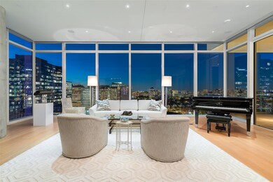 Living room featuring floor to ceiling windows and