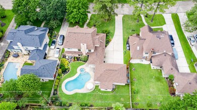 Don't forget that the home has full gutters, an automatic sprinkler system and a 16' by 14' covered back patio with ceiling fan.  Scroll through all the photos as there are more pool pictures at the end...