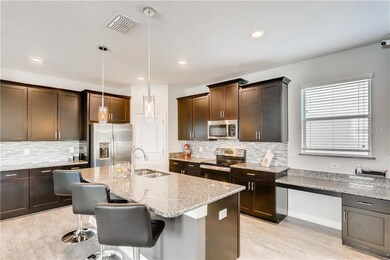 Spacious kitchen with island and built-in desk