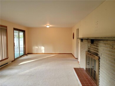 Spacious LR with Hardwoods under carpeting,  Brick