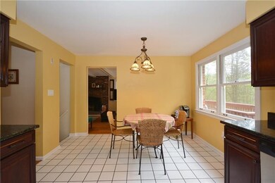 Kitchen eat-in area with Family Room beyond.