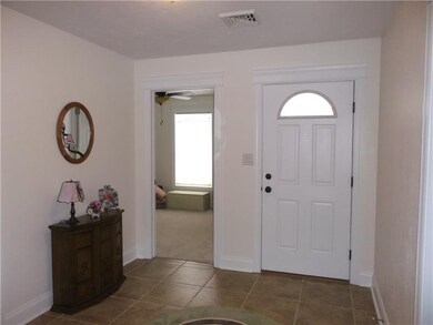 Entry way features a large walk in closet and cera
